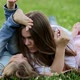 Woman with Children Lies in the Meadow and Have Fun - VideoHive Item for Sale