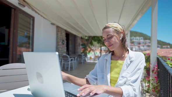 Young Female Businesswoman Freelancer Working By Laptop Outdoors at White Open Terrace Beautiful