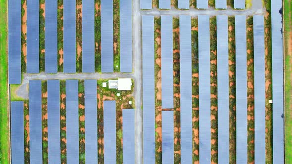Drone fly over solar farm, renewable energy from solar.