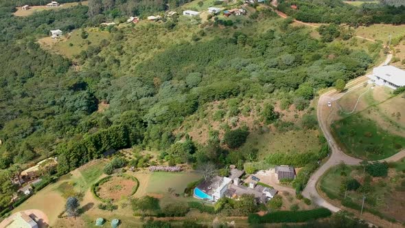 Aerial View of Valley with Farm Field, Forest and Villa in Tropical Country