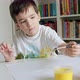 Boy Reaching for Paints With Paintbrush and Painting - VideoHive Item for Sale