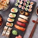 Various Kinds of Sushi Placed on Black Stone Board - VideoHive Item for Sale