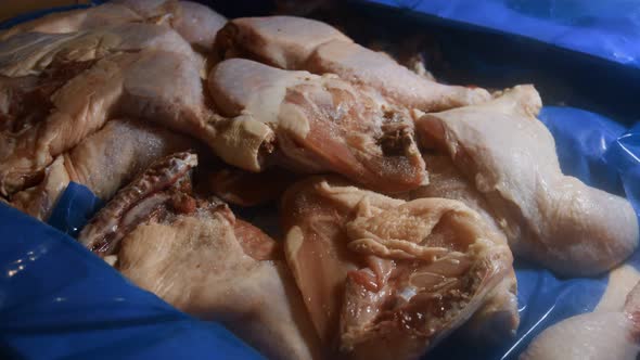 Closeup View of a Box Full of Frozen Chicken Legs