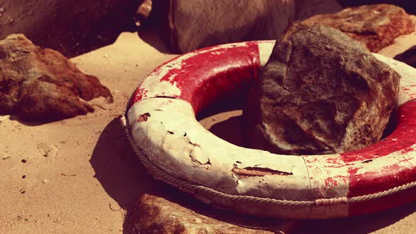 Old Broken Lifebuoy on Sea Beach