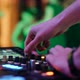 DJ mixing in a small home party - VideoHive Item for Sale