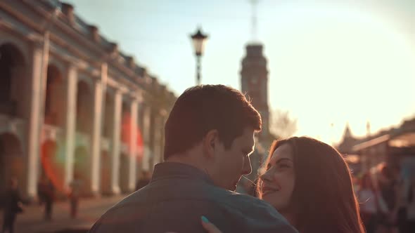 Young Cute Couple Having Fun in the City Near Big Road and Crowd.