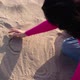 Young Woman Draws a Heart on the Sand Close Up - VideoHive Item for Sale
