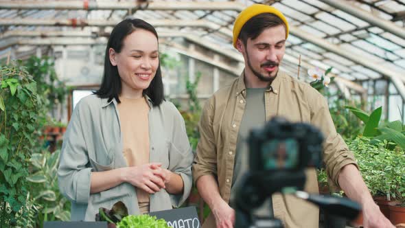 Young Woman and Man Filming Show about Harvest