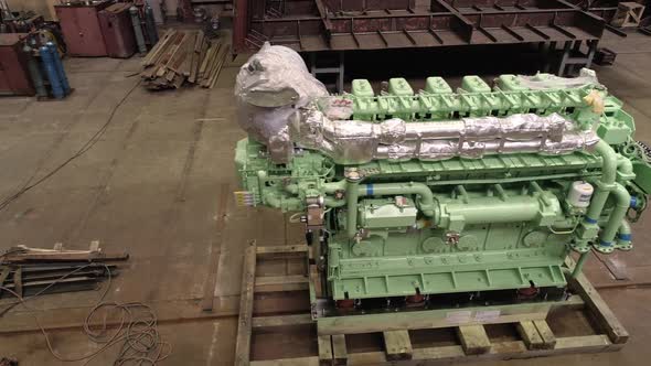 Large Engine and Skilled Employees in Spacious Dry Dock