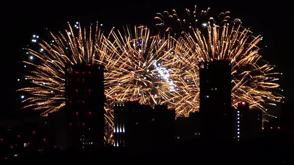 Fireworks on the Background of the Buildings of the Night