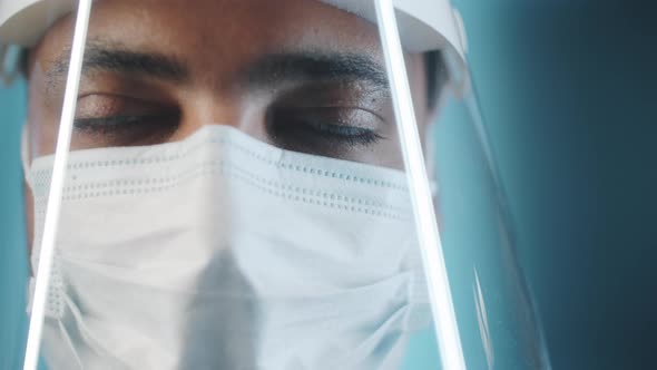 Portrait of Male Doctor in Face Shield and Mask