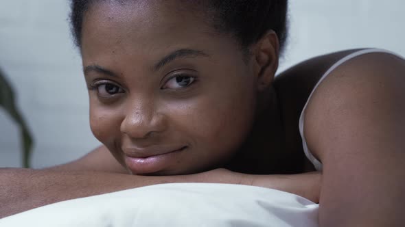 Portrait Beautiful African American Girl Lying in Bed Smiling Young Black Woman with Curly Hair