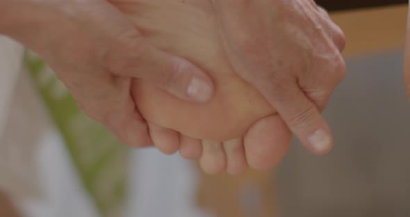 The Masseur Makes a Massage of the Toes