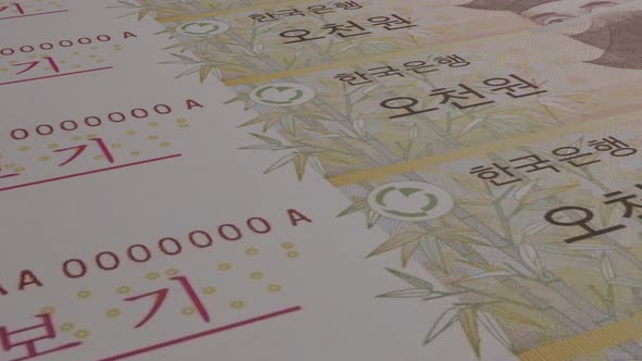 South Korean won bills background. Many banknotes.