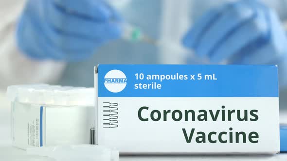 Box with Coronavirus Vaccine on the Table