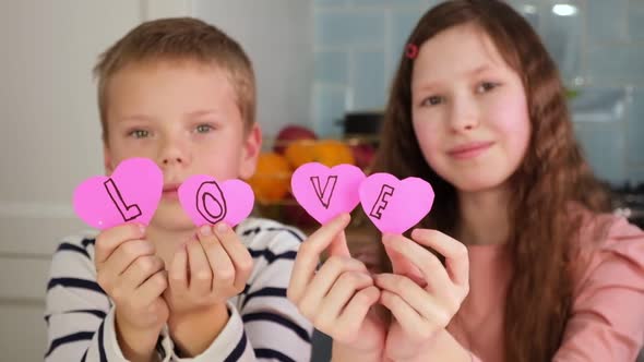 Kids Children Doing Valentine's Day Arts and Crafts with Hearts Paper