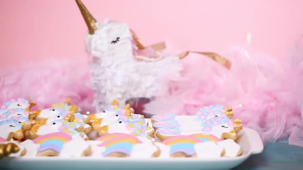 Unicorn sugar cookies decorated with royal icing at the kids birthday party.