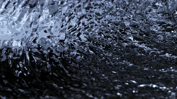 Super Slow Motion Shot of Waving Dark Water Texture at 1000Fps