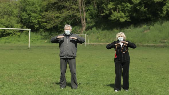 Active Senior Old Couple. Man and Woman Do Stretching Physical Exercises