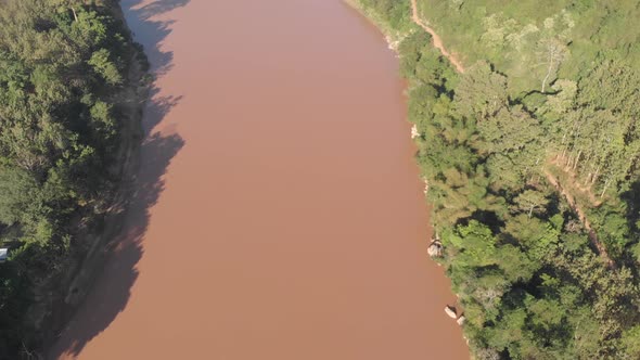 Aerial: flying over Nam Ou River Nong Khiaw Muang Ngoi Laos, scenic valley