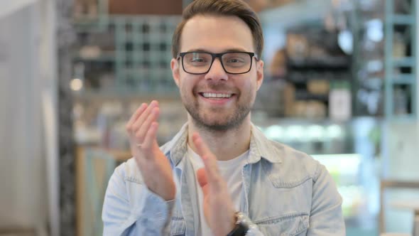 Young Man Clapping Applauding