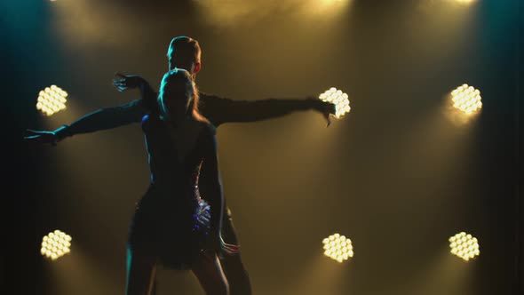 Rumba Drive Dance Performed By a Young Pair of Ballroom Dancers