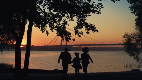 Happy Family Silhouette Run to River Hold Hands