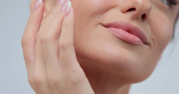 Closeup Beauty Portrait of Young Woman with Smooth Healthy Skin She Gently Touches Her Face with Her