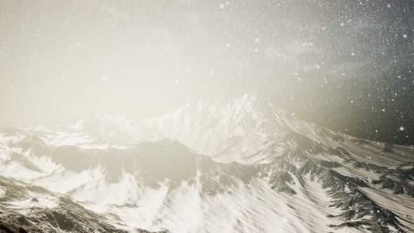 Heavy Snowing, Focused on the Snowflakes, Mountains in the Background alt