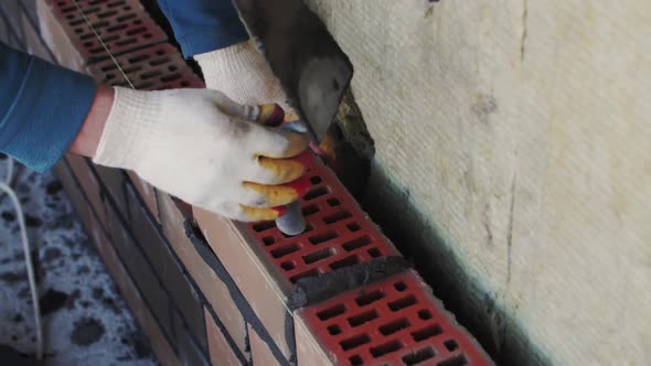 close-up bricklaying, builder's hands, footage of construction