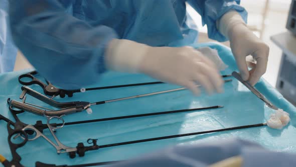 Close Up of Nurse's Hand Cleaning the Table After Surgery