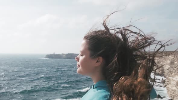 Woman Enjoying View of Sea in Windy Weather Slow Motion