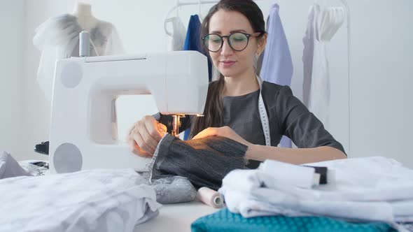 Concept of Hobby and Small Business Woman Tailor Working on Sewing Machine