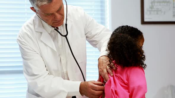 Male doctor examining a patient