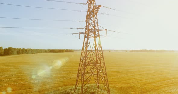 Vertical Movement Flight Near High Voltage Electricity Tower and Power Lines at Green and Yellow