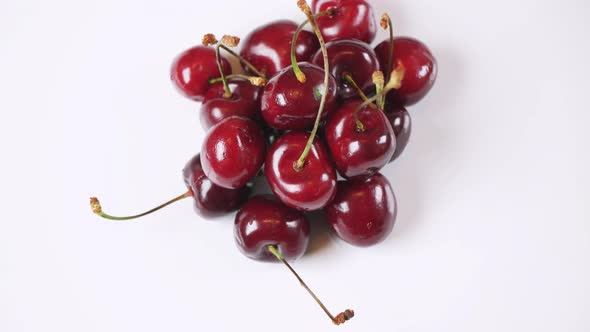 Fresh Juicy Red Cherry Rotating Slowly White Background