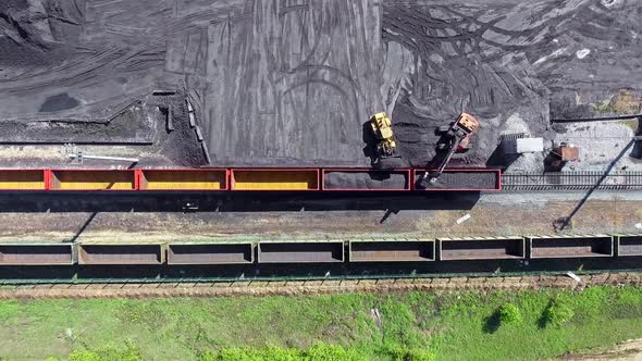 View Above Loader Loads Coal Into Wagons