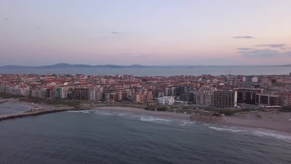 Aerial view of Pomorie city that is located on Black Sea shore at sunset. Top view of sand beaches
