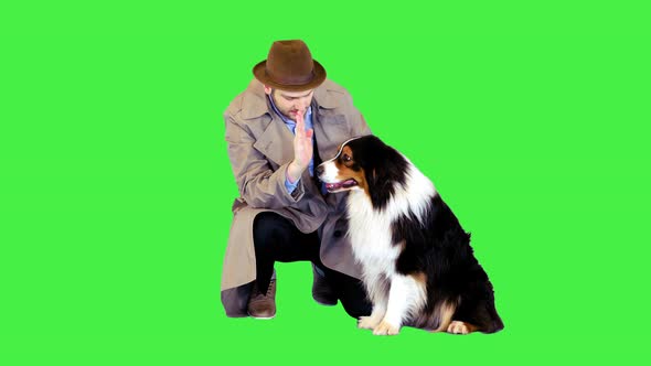 Detective Giving High Five to His Dog on a Green Screen Chroma Key