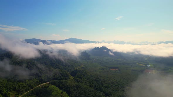 Aerial top view from drone above the mountain fog in the morning