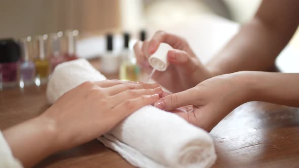 woman doing nails