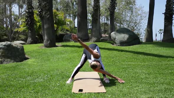 Young Blonde Woman is Doing Gymnastic Exercises