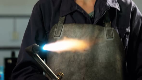Female welder holding welding torch