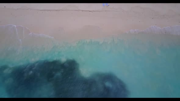 Aerial drone shot texture of luxury resort beach adventure by aqua blue water with white sandy backg