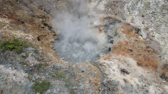 Aerial view of vulcano crater with sulfur vapor coming out of the sulfur marsh.