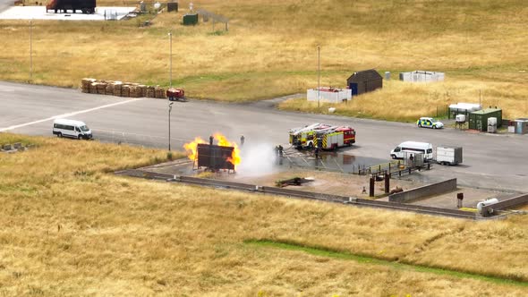 Firefighters Undergoing Training in a Mock Fire Response Emergency