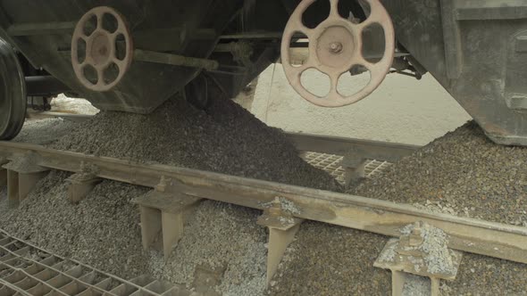 Close up of cement wagons unloading hopper