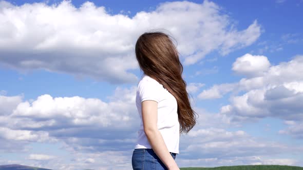 Happy Child with Long Beautiful Hair Enjoy the Sun on Sky Background Happiness