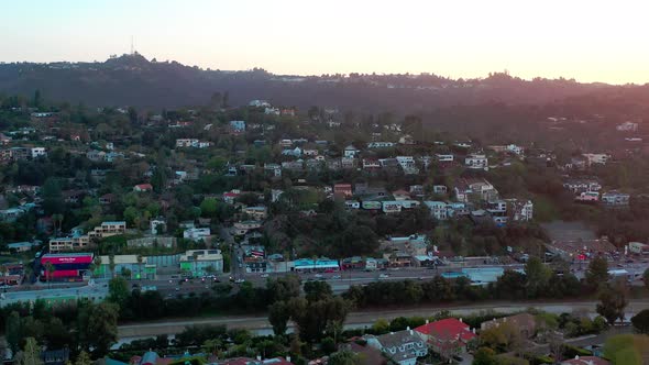 Aerial: Hollywood Hills during magic hour. Los Angeles, CA