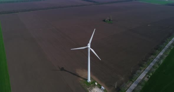 Aerial view of a wind turbine. Windmill for electric power production. Green energy.